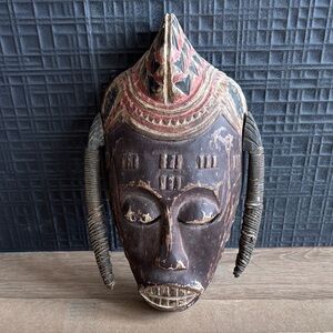 Handcrafted Tribal Mask with Red and Brown Accents